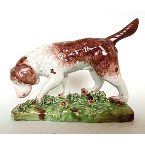 1249 - A 19th century Staffordshire hound dog, 10.5 cm high