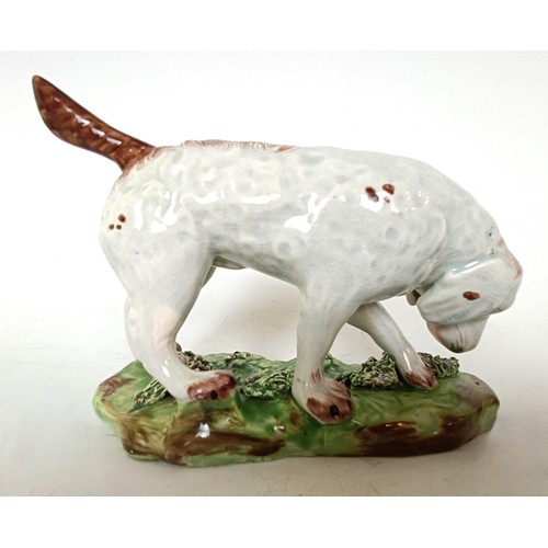 1249 - A 19th century Staffordshire hound dog, 10.5 cm high