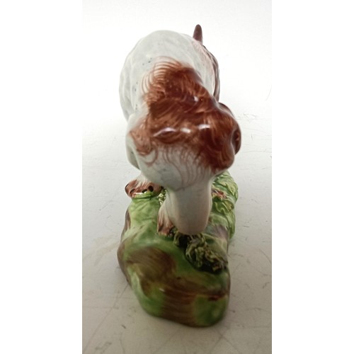 1249 - A 19th century Staffordshire hound dog, 10.5 cm high