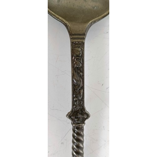 1250 - A pewter spoon, with figural finial