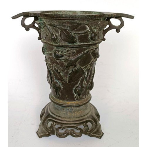 1251 - A bronze vase, in the Oriental manner, decorated flowers, 12 cm high