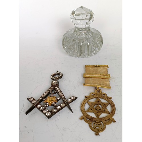 1253 - A Masonic paste set jewel, boxed, a Masonic silver gilt medallion, boxed, and a Masonic glass paperw... 