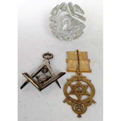 1253 - A Masonic paste set jewel, boxed, a Masonic silver gilt medallion, boxed, and a Masonic glass paperw... 