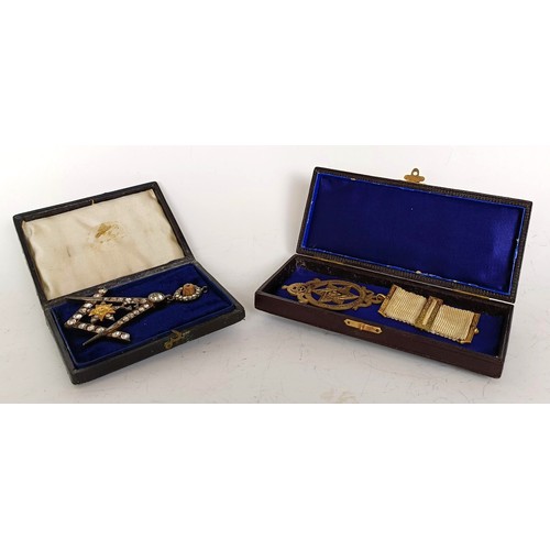 1253 - A Masonic paste set jewel, boxed, a Masonic silver gilt medallion, boxed, and a Masonic glass paperw... 