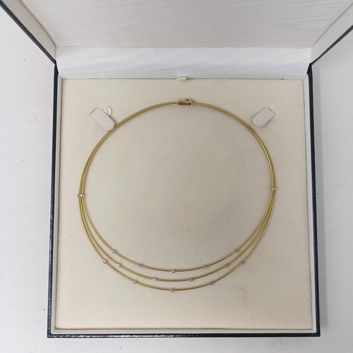 473 - An 18ct gold and diamond necklace, 21 g