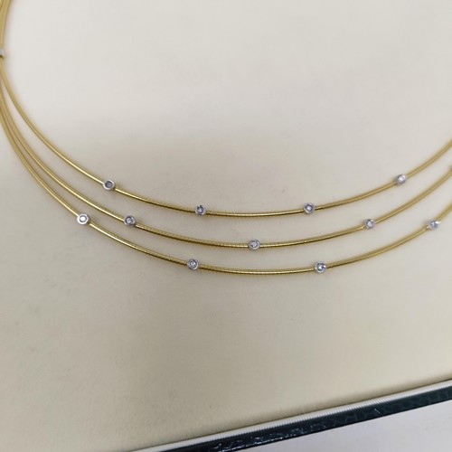 473 - An 18ct gold and diamond necklace, 21 g