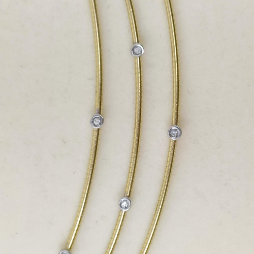 473 - An 18ct gold and diamond necklace, 21 g