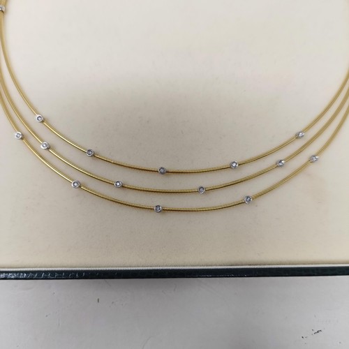 473 - An 18ct gold and diamond necklace, 21 g