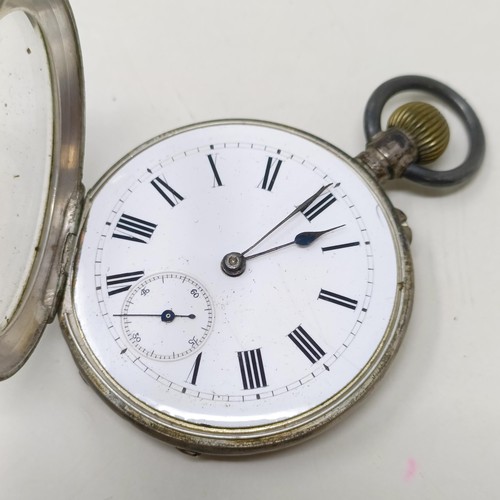 655 - A silver open face pocket watch, with a chain, and another silver open face pocket watch (2)