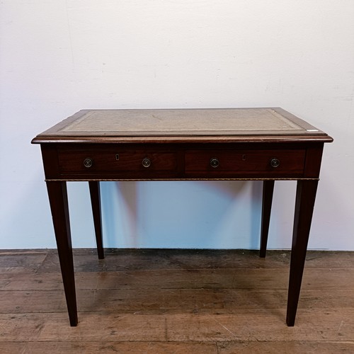 1328 - A late 19th century mahogany writing table, with gilt metal mounts, having two frieze drawers, 89 cm... 