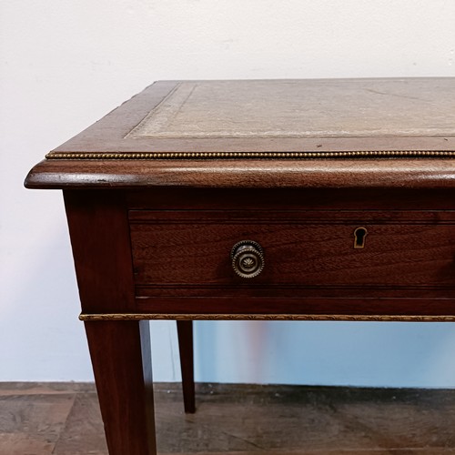 1328 - A late 19th century mahogany writing table, with gilt metal mounts, having two frieze drawers, 89 cm... 