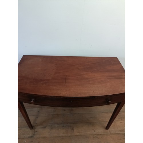 1304 - A mahogany bow front side table, with a single drawer, 103 cm wide