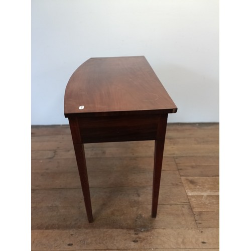 1304 - A mahogany bow front side table, with a single drawer, 103 cm wide