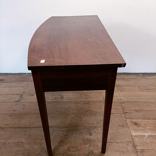 1304 - A mahogany bow front side table, with a single drawer, 103 cm wide