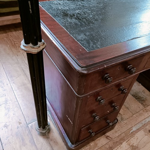 1325 - A 19th century mahogany desk, having seven drawers, 140 cm wide