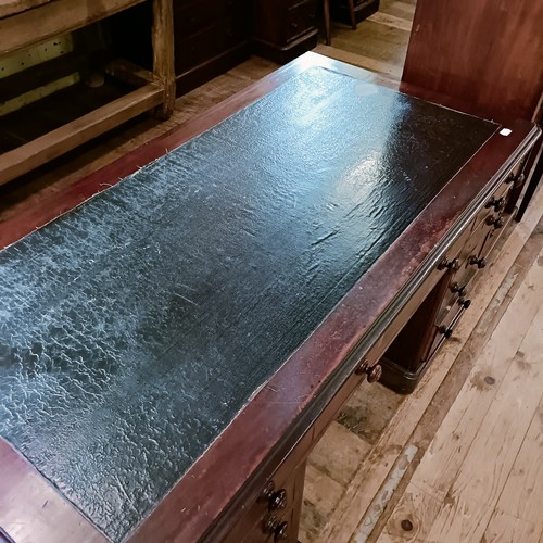 1325 - A 19th century mahogany desk, having seven drawers, 140 cm wide