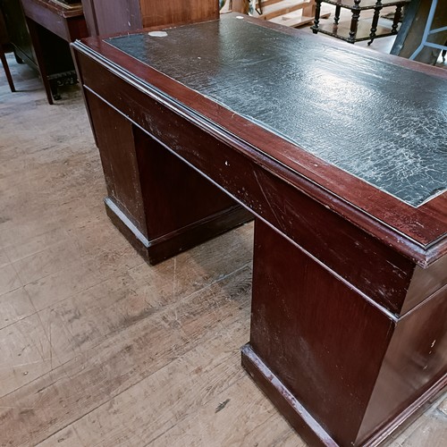 1325 - A 19th century mahogany desk, having seven drawers, 140 cm wide