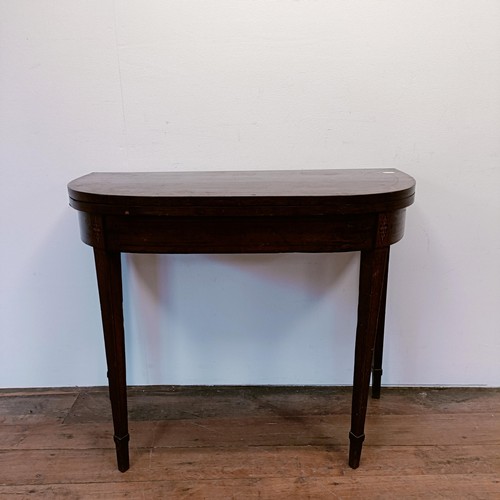 1308 - A mahogany folding card table, 95 cm wide