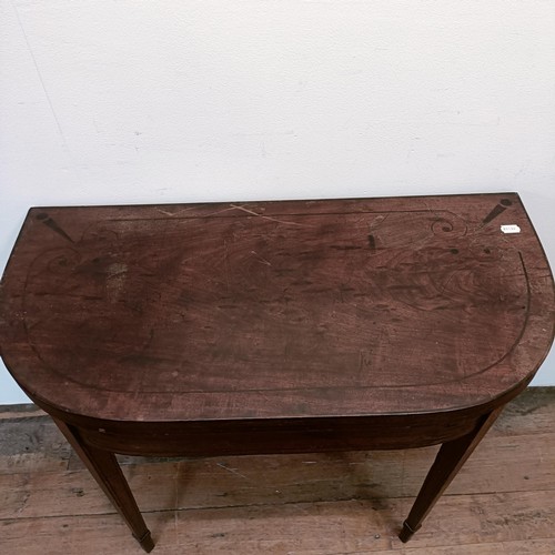 1308 - A mahogany folding card table, 95 cm wide