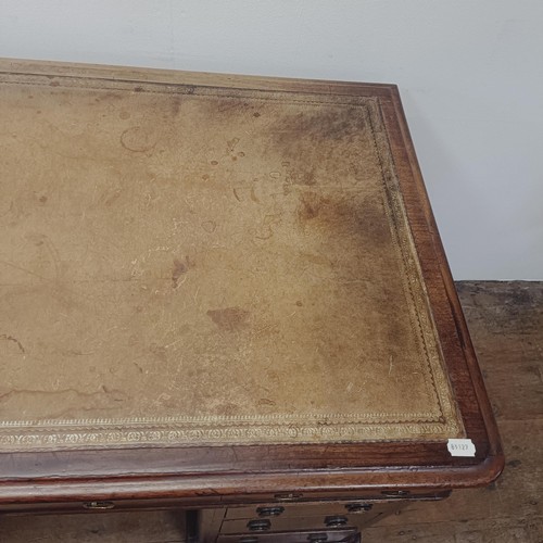 1285 - A mahogany pedestal desk, having nine drawers, 128 cm wide