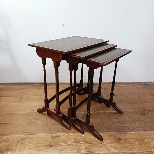 1317 - A nest of three mahogany tables, inset with leather tops, 53 cm wide, a rectangular wine table, 45 c... 