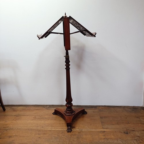 1315 - A 19th century rosewood duet stand, with two pierced adjustable music holders, on a carved column su... 