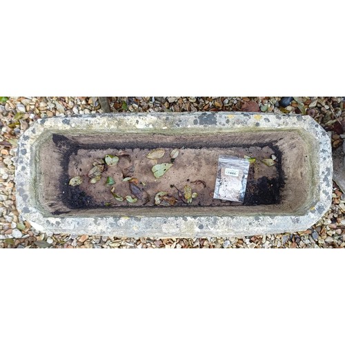 1444 - A composite stone rectangular planter, with carved lion decoration, on composite stone stands...