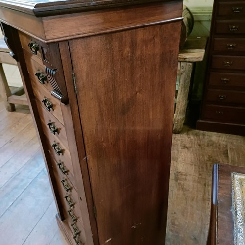 1326 - A late 19th century Wellington mahogany chest, having eleven drawers, 130 cm high x 80 cm wide