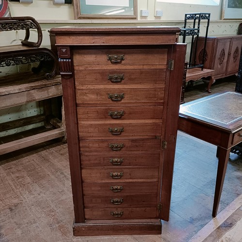 1326 - A late 19th century Wellington mahogany chest, having eleven drawers, 130 cm high x 80 cm wide