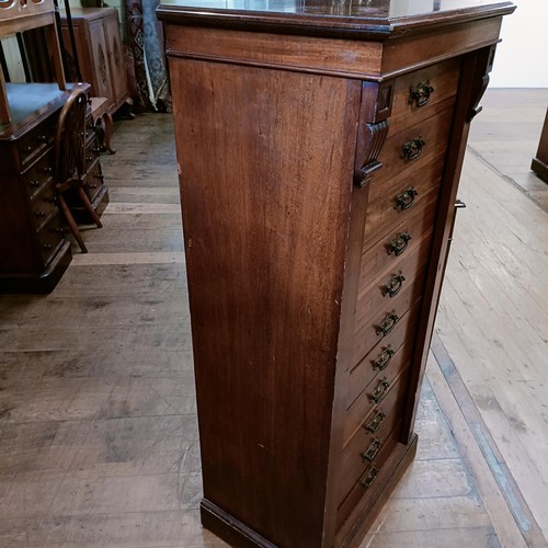 1326 - A late 19th century Wellington mahogany chest, having eleven drawers, 130 cm high x 80 cm wide