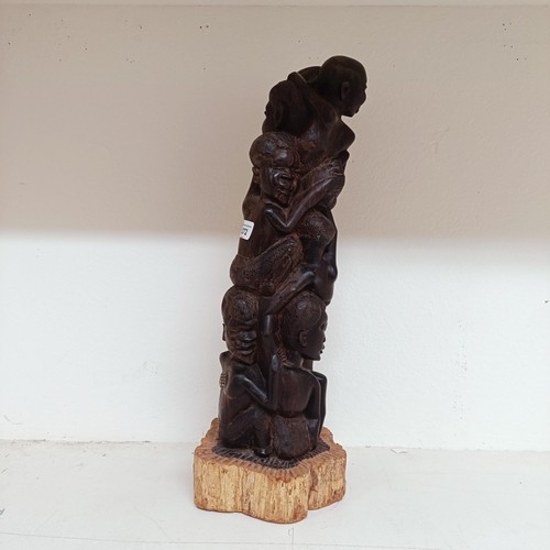 1272 - A large South African Makonde wood carving, decorated figures, 52 cm high