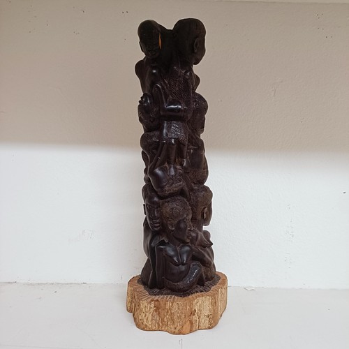 1272 - A large South African Makonde wood carving, decorated figures, 52 cm high