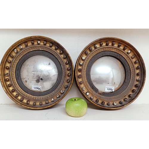 1280 - A small pair of early/mid 19th century convex wall mirrors, 29.5 cm diameter (2)