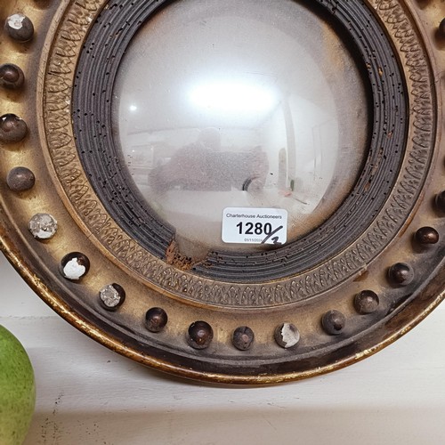 1280 - A small pair of early/mid 19th century convex wall mirrors, 29.5 cm diameter (2)