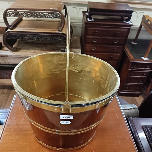 1320 - A 19th century mahogany and brass bound tea bucket, 36 cm wide