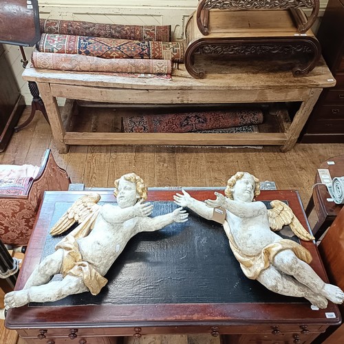 1324 - A large pair of carved and painted cherubs, 76 cm high x 46 cm wide (2)