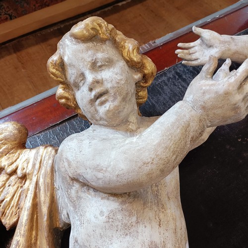 1324 - A large pair of carved and painted cherubs, 76 cm high x 46 cm wide (2)