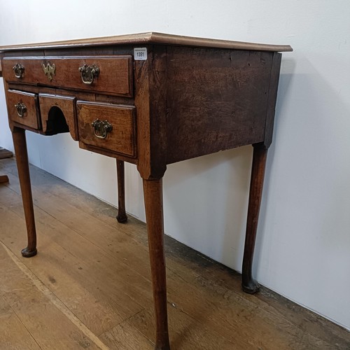 1351 - An 18th century style walnut lowboy, having five drawers, 84 cm wide