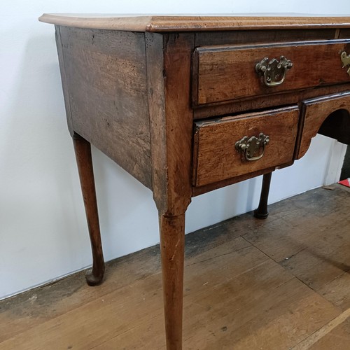 1351 - An 18th century style walnut lowboy, having five drawers, 84 cm wide