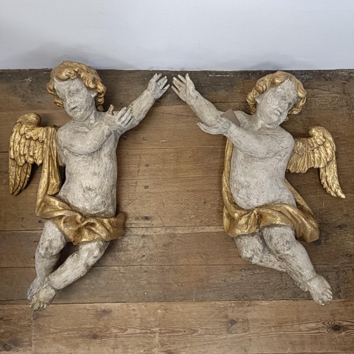 1324 - A large pair of carved and painted cherubs, 76 cm high x 46 cm wide (2)