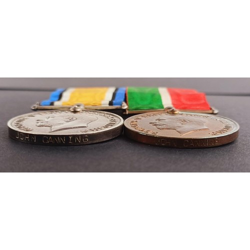 48 - A pair of medals, awarded to John Canning, comprising a British War medal and a Mercantile Marine me...