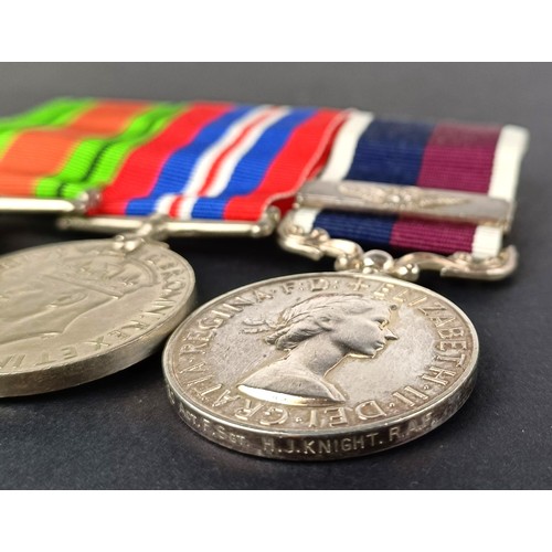 55 - A group of three medals, awarded to 591730 ACT F Sgt H J Knight RAF, comprising a Defence medal, War...