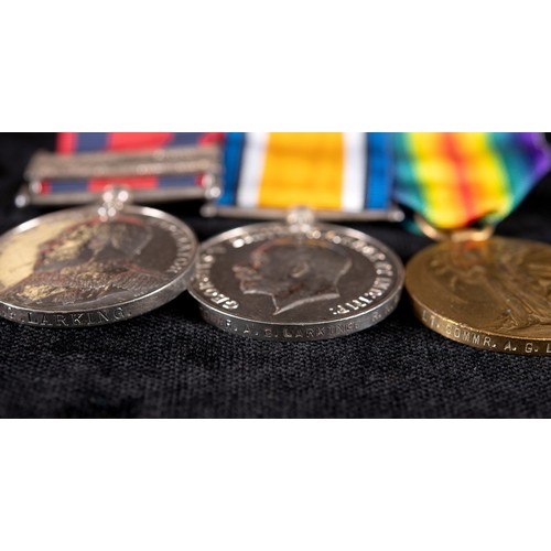 85 - A group of three medals, awarded to Lt Commander A G Larking RNR, comprising a Transport medal, with... 