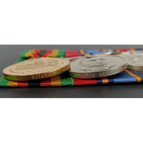 214 - A group of three medals, awarded to 10755P F/R Huggins MJ, comprising a Zimbabwe Independence medal,... 