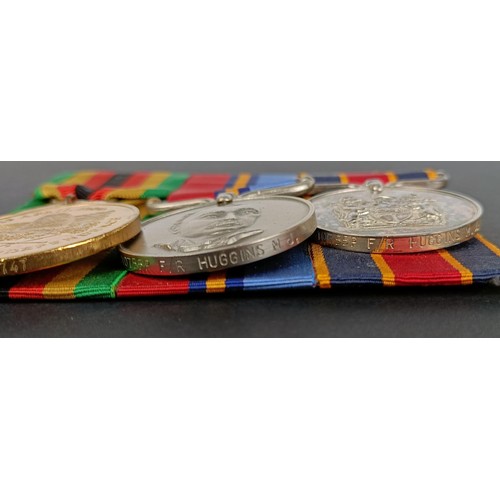 214 - A group of three medals, awarded to 10755P F/R Huggins MJ, comprising a Zimbabwe Independence medal,... 