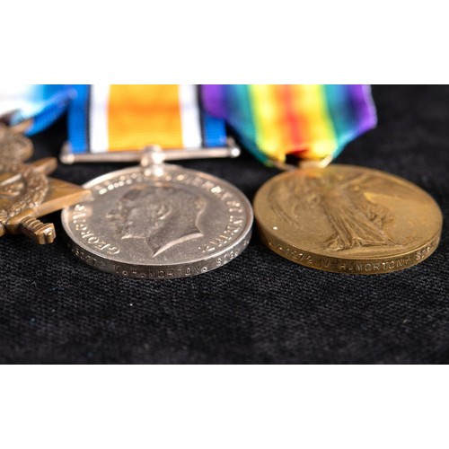 225 - A group of four medals, awarded to J 30272 V H Morton Sig Boy RN, comprising a Distinguished Service... 