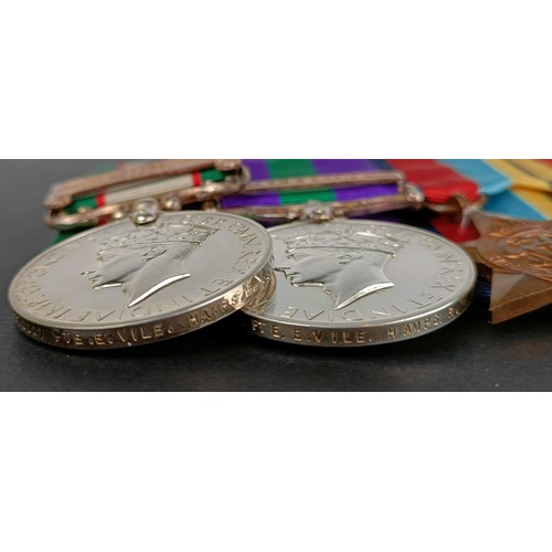 233 - A group of seven medals, awarded to 5670027 Pte E Vile Hampshire Regiment, comprising an India Gener... 