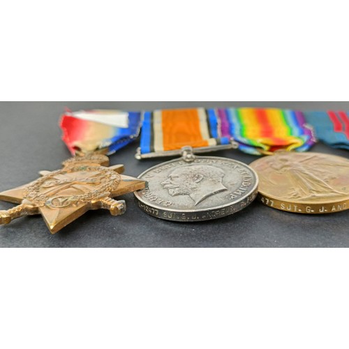 238 - A group of four medals, awarded to 12477 Cpl G Andrews R Fus, comprising a 1914-15 Star trio, and a ... 