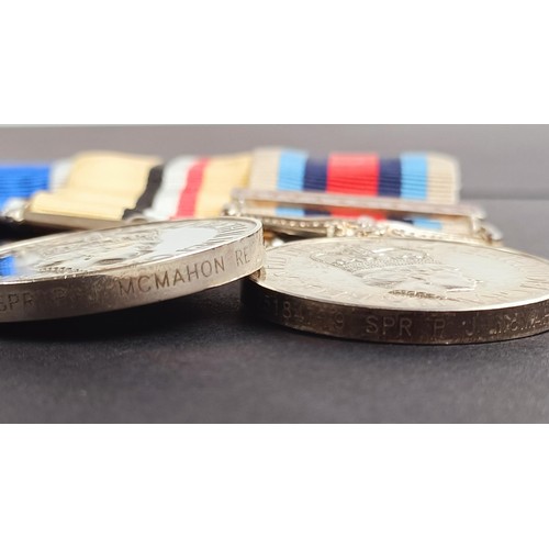 242 - A group of three medals, awarded to 25184719 Spr P J McMahon RE, comprising a NATO service medal, wi... 