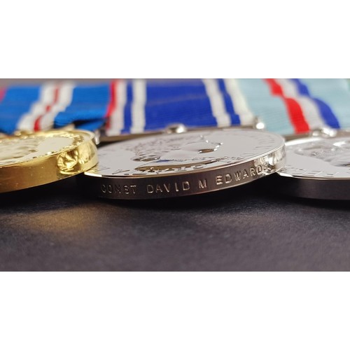 243 - A group of four medals, awarded to Constable David M Edwards, comprising a Golden Jubilee medal 2002... 